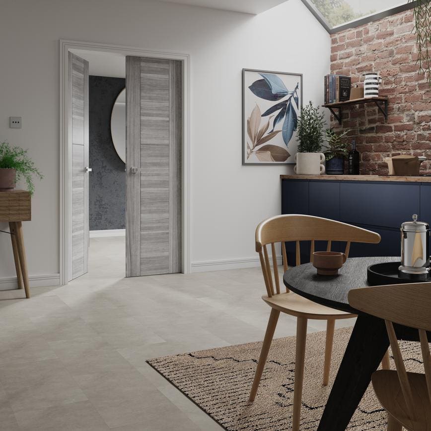 Grey internal door opening into an open-plan kitchen diner in Newcastle