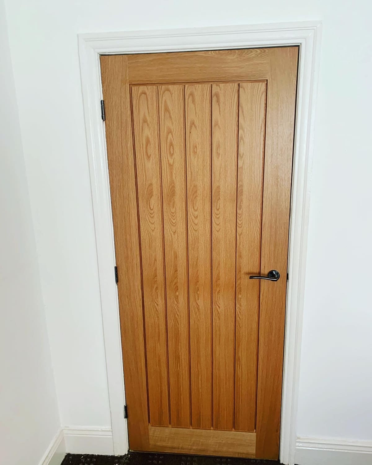 Oak cottage-style internal door fitted in a Newcastle home