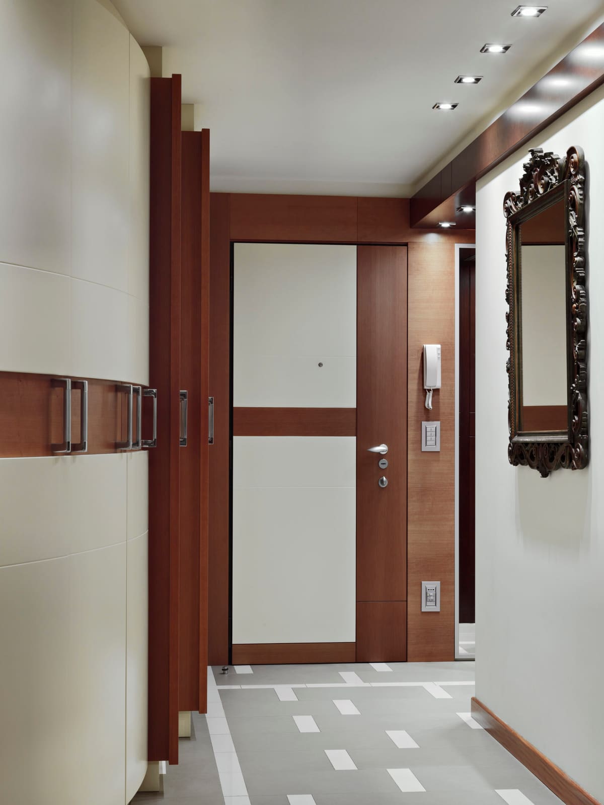 Walnut and white internal doors along a modern hallway