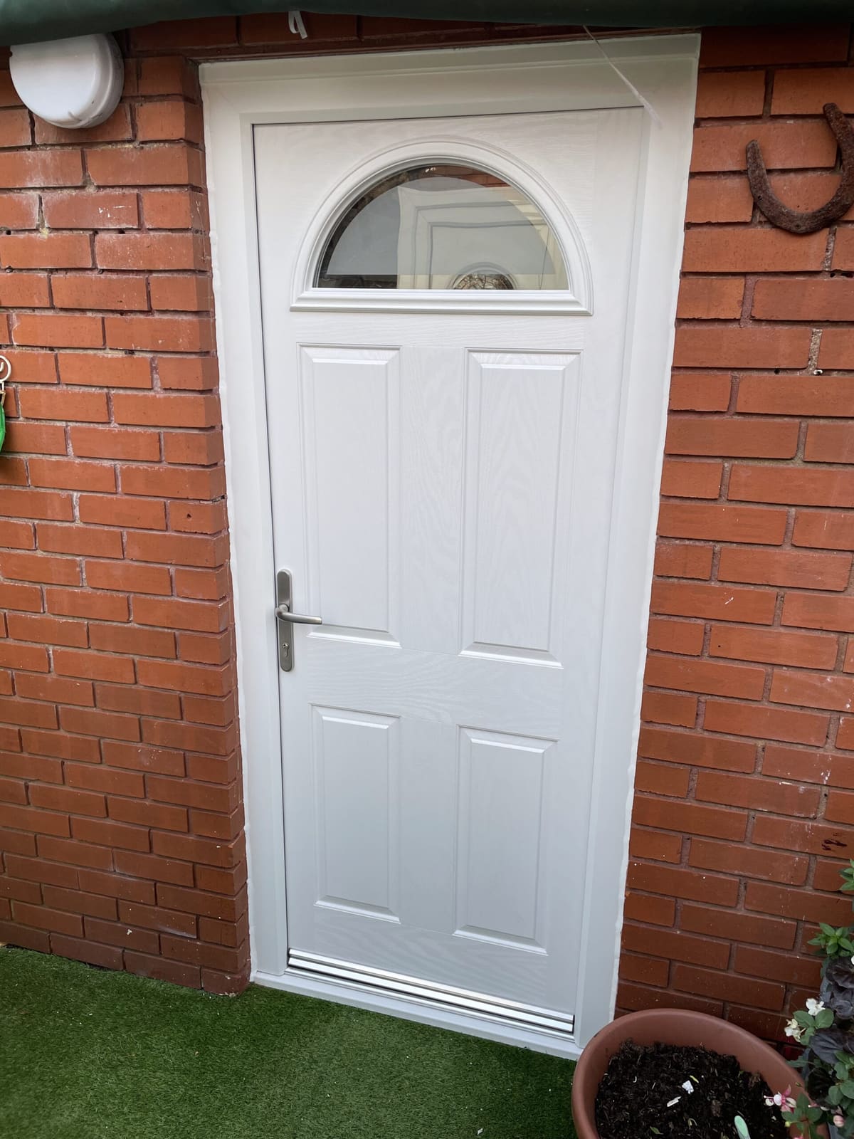 White back door with arched glass panel fitted in Newcastle