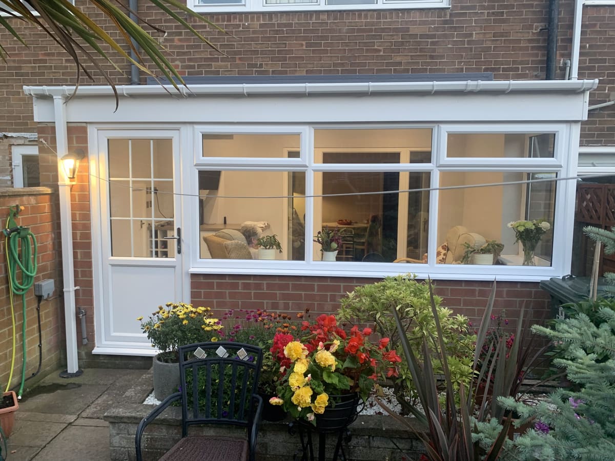 White uPVC door and windows on a lean-to extension in Newcastle